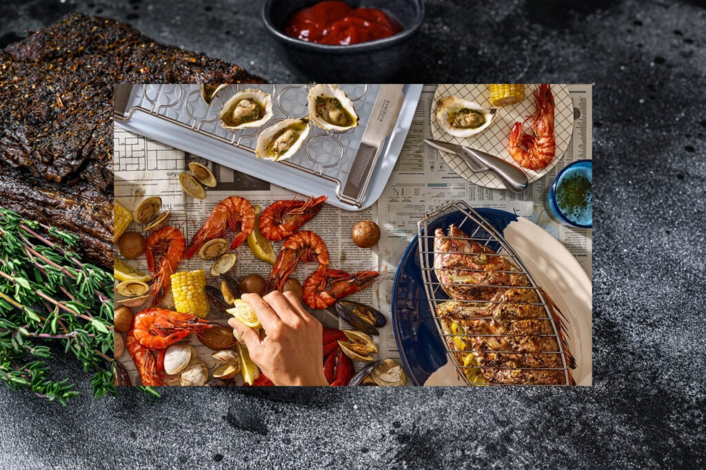 A deliciously grilled fish surrounded by top-notch BBQ tools and accessories.